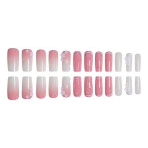 Pink gradient press-on nails set with 3D white flowers, pearls, and silver glitter lines