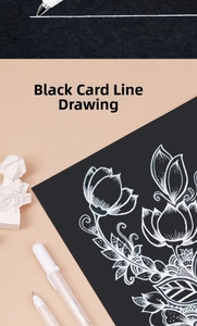 Detailed white highlight pen floral drawing on black cardstock for sketching art