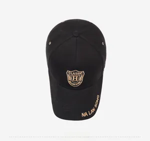 Close-up of golden shield embroidery and CLASSIC lettering on a black cotton baseball cap