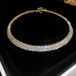 Macro shot of French luxury style double-row rhinestone choker necklace on black velvet