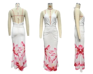 Detail view of white halter neck maxi dress with floral print and waist ruching design
