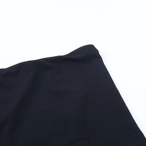 Close-up of the mesh fabric texture and waist detail of the black off-shoulder top