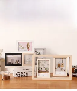 Multi-slot wooden photo frames in black white and wood tones displayed on a desk