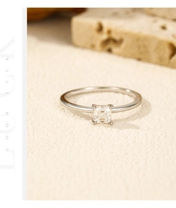 Macro shot of square-cut moissanite ring with four-prong setting on s925 silver band