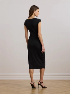 Elegant black long-sleeve bodycon dress with split hem and metal waist detail