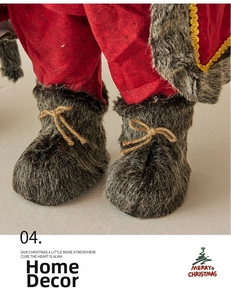 Detail of red felt pants and grey faux fur boots with twine bows on Santa figurine