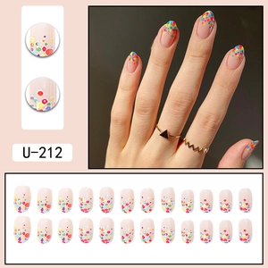 Colorful candy polka dot press-on nails with natural oval shape and glossy finish