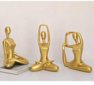 Set of three golden yoga statues in various poses for modern luxury home decor