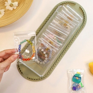 Clear jewelry storage organizer with acrylic box and sealed plastic zipper bags