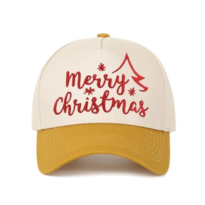Macro detail of Merry Christmas red embroidery on color-block canvas trucker hat