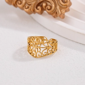 Elegant gold hollow patterned stainless steel ring featuring a vintage bohemian design