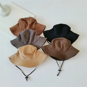 Flat lay of multi-color outdoor sun hats with chin straps and side snap buttons