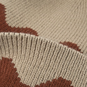 Women's warm thick knit beanie in beige and brick red with textured pattern