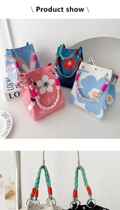 Detail of knitted tote bag with floral patterns, magnetic closure and rope handles