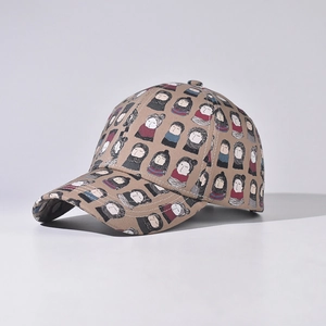 Detailed view of khaki canvas baseball cap featuring artistic cartoon character print
