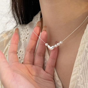 Elegant 925 sterling silver heart necklace with white pearls on a delicate chain