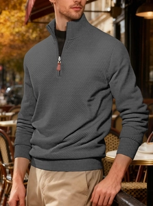 Detail of grey ribbed knit sweater featuring stand collar and brown leather zipper pull
