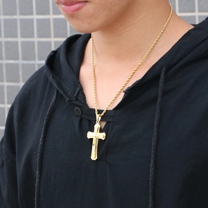 Men's double-layered gold stainless steel cross pendant with rope chain on a model