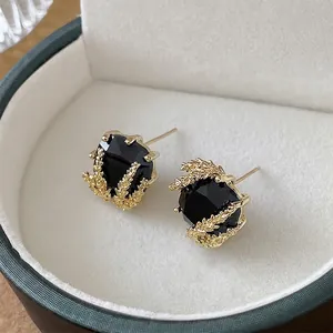 Boucles d'oreilles épi de blé dorées avec pierres noires carrées et diamants fins
