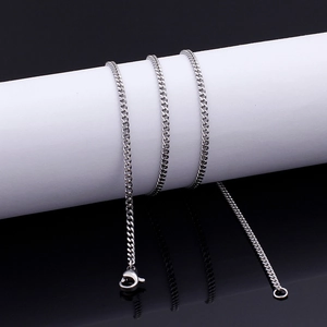 Detailed view of silver Cuban link necklace with lobster clasp on white display stand