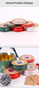 Close-up of Merry Christmas gold stamped polyester ribbons with snowflakes for gift wrapping