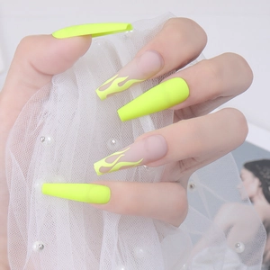 Matte neon yellow flame press-on nails in long coffin shape for stylish women