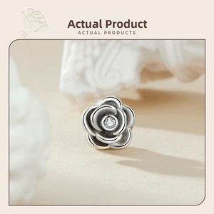Detailed view of S925 sterling silver rose bead with sparkling center zircon stone