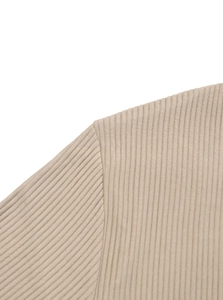 Close-up detail of beige knit fabric texture and shoulder seam on a men's henley shirt