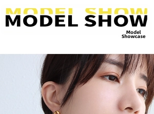 Close-up of gold twist rope chain earrings on model showing metal texture and shine