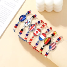 Handcrafted woven beaded bracelets featuring various national flags on metal oval plates