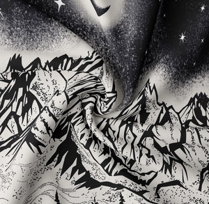 Detailed texture of black and white mountain tapestry with dot art starry sky