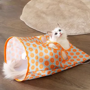 Orange print cat tunnel toy with hanging plush ball and multiple holes for interactive play