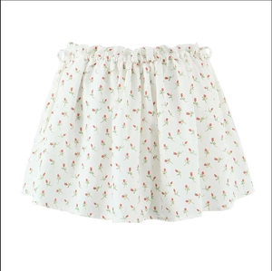 Detail of high waist floral mini skirt featuring red rose print and elastic waistband