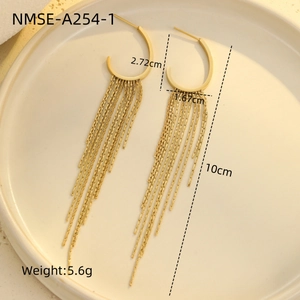 Detail shot of 10cm gold tassel earrings with weight and size specs on a tray