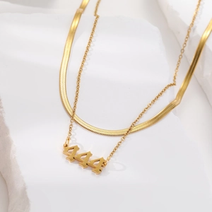 Double-layered gold necklace with 444 angel number pendant and flat snake chain style