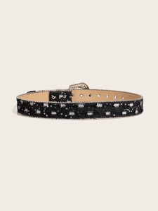 Detail of black fabric belt featuring silver studs and shiny square sequins decoration