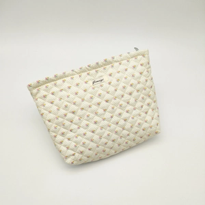 Quilted cotton makeup bag with floral bear pattern and metal zipper closure