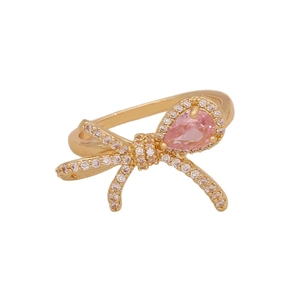Elegant gold bow ring with pink pear-shaped stone and cubic zirconia details