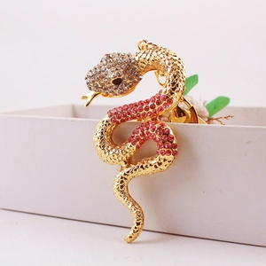 Creative snake keychain with pink and white rhinestones in gold metal for car bags