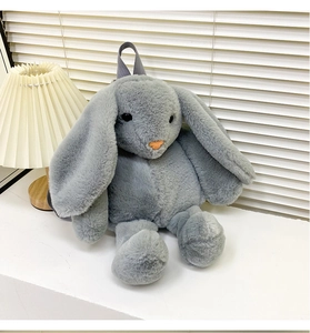 Detail of plush long-eared bunny backpack with soft faux fur and convenient top handle