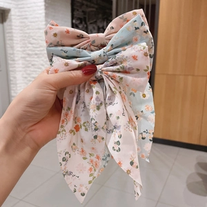 Floral print bow hair clip set with long ribbons in pink, blue, and beige colors