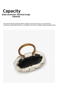 Top view of white pleated cloud handbag showing large capacity and resin ring handle