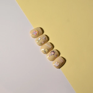 Macro detail of 5D embossed nail stickers featuring cute cartoon girls and tulips