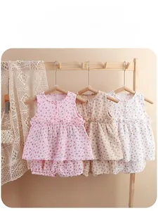 Close-up of baby girl floral cotton gauze pajama set with sleeveless top and bloomers
