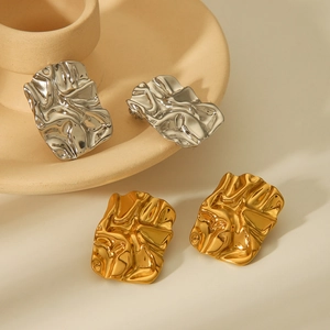 Irregular 18K gold and silver titanium steel lava fold earrings with hammered texture