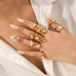 Gold plated stainless steel rings with sparkling zircon crystals in various shapes