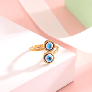 Detailed close-up of golden Evil Eye adjustable open ring with blue enamel design