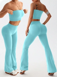 Detail of high-stretch light blue yoga set with strapless top and flare leggings