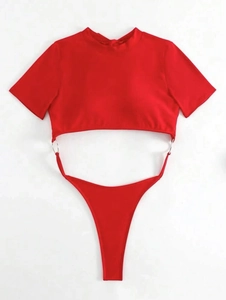 Detail of red backless swimsuit featuring short sleeves, high neck and metal ring links