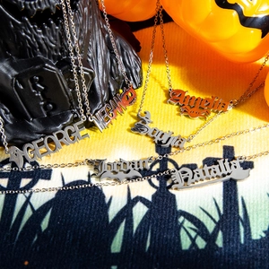 Custom Halloween name necklaces in gothic style with ghost and pumpkin elements